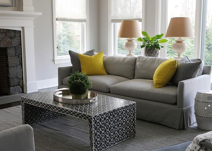 Gray Sofa With Bright Yellow Pillows And Black Waterfall Intended For 2019 Yellow And Black Console Tables (View 9 of 10)
