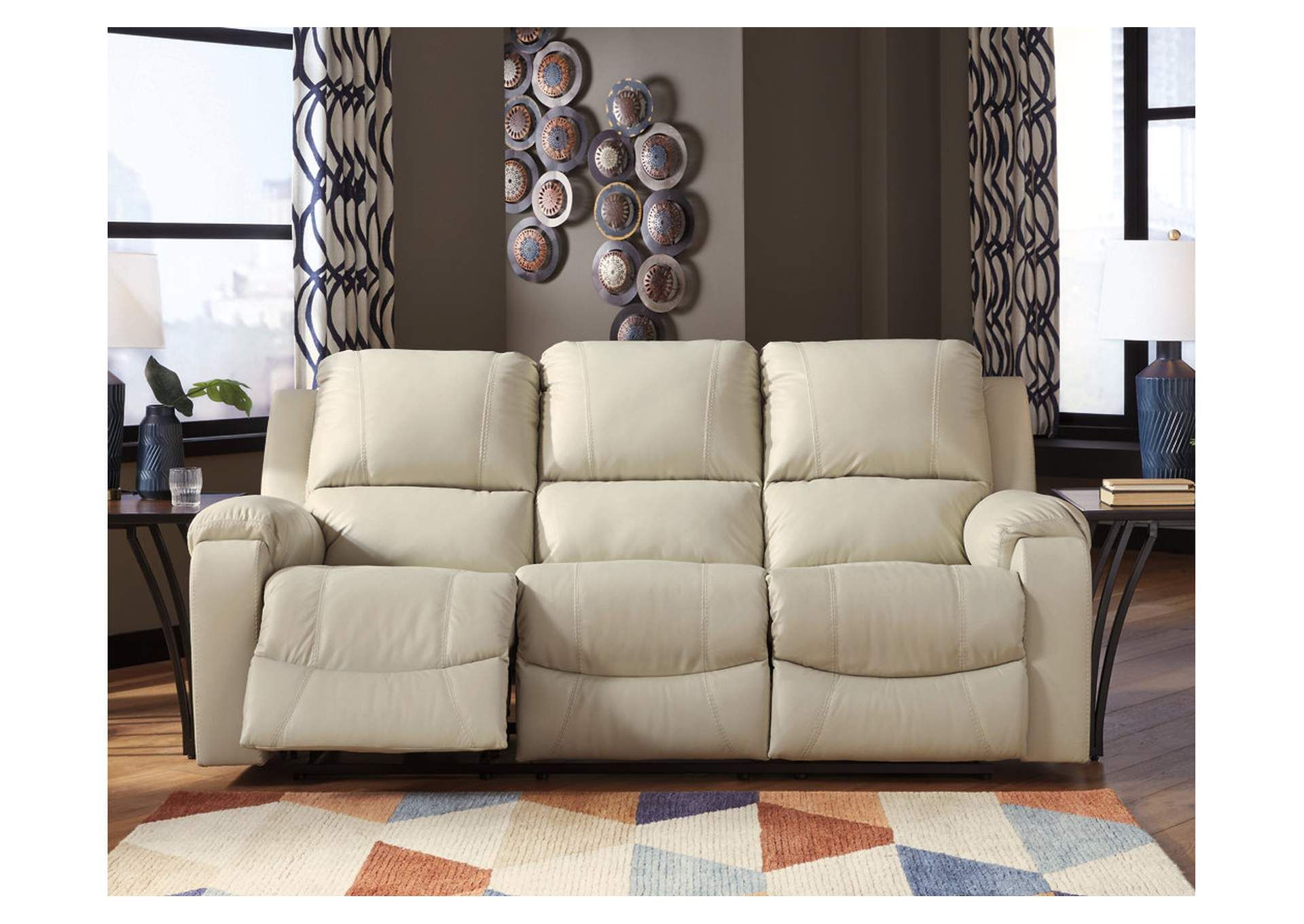 Brown/beige Rackingburg Reclining Sofa Spiller Furniture & Mattress In Preferred Round Beige Faux Leather Ottomans With Pull Tab (View 8 of 10)