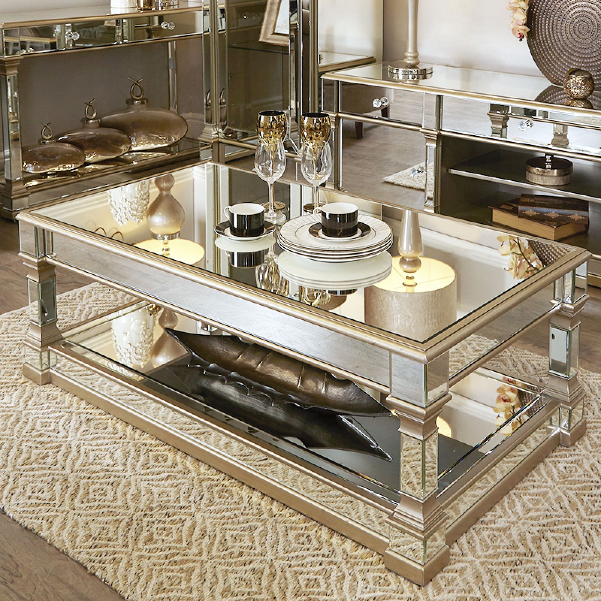 Most Current Mirrored Modern Coffee Tables Inside Andreas Champagne Gold Trim Mirrored Coffee Table (View 4 of 10)
