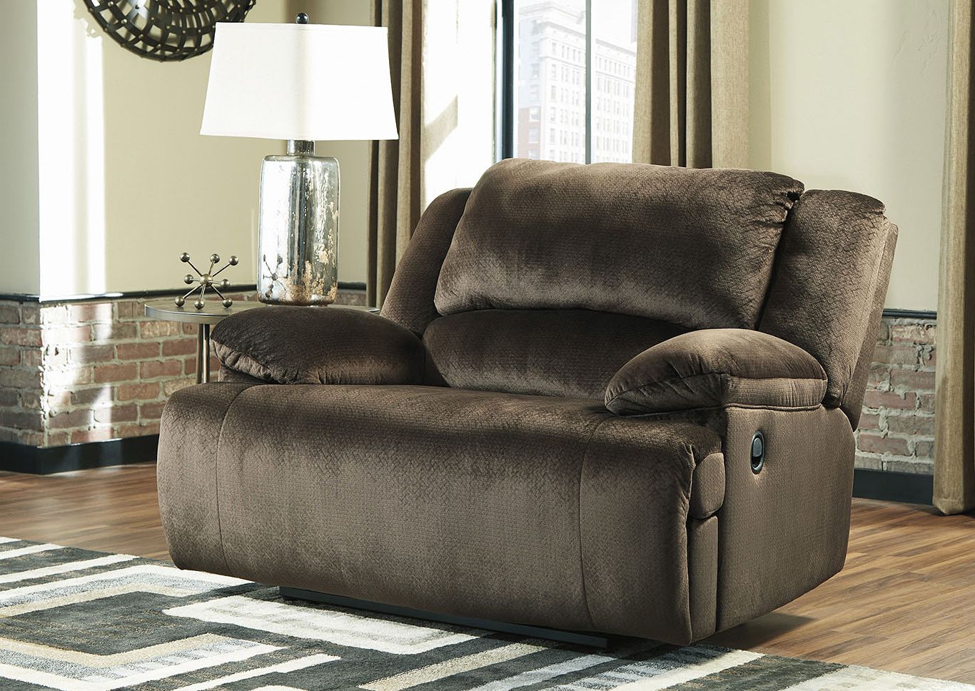 Round Beige Faux Leather Ottomans With Pull Tab Regarding Well Known Clonmel Oversized Recliner Roberts Furniture & Mattress (View 9 of 10)