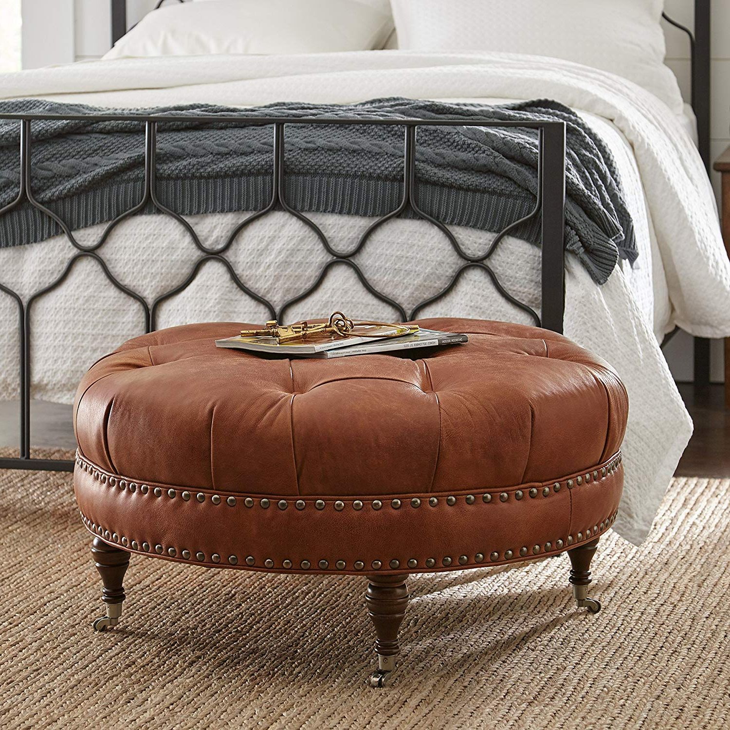Trendy Button Tufted Round Leather Wheeled Ottoman With Spindled Wooden Legs Regarding Tufted Ottomans (View 1 of 10)