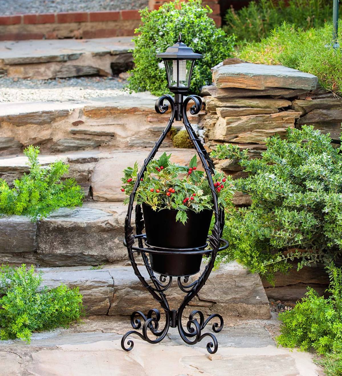 Popular Wrought Iron Plant Stands With Regard To Black Wrought Iron Plant Stand With Solar Light (View 5 of 10)